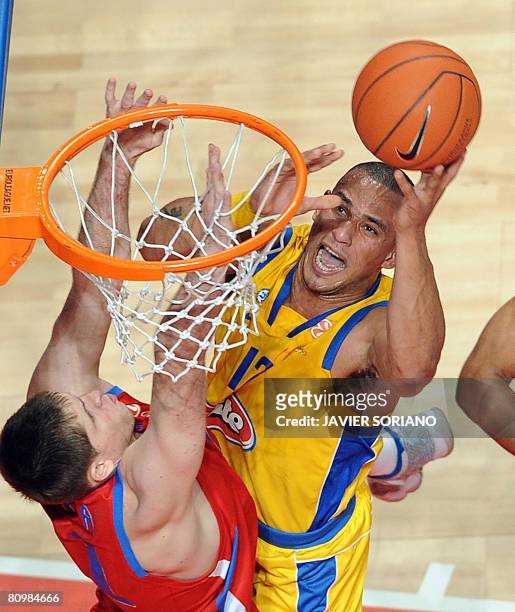 Maccabi Tel Aviv's Alex Garcia jumps to score in front of CSKA Moscow's Victor Khryapa during their Euroleague Final Four basketball final game on...
