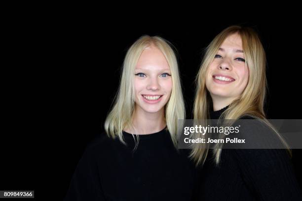 Vilma Sjoeberg is seen with another model backstage ahead of the Dorothee Schumacher show during the Mercedes-Benz Fashion Week Berlin Spring/Summer...