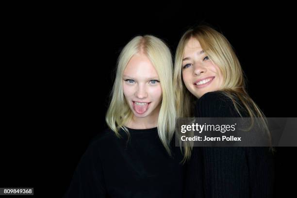 Vilma Sjoeberg is seen with another model backstage ahead of the Dorothee Schumacher show during the Mercedes-Benz Fashion Week Berlin Spring/Summer...