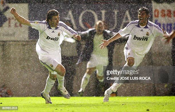 Real Madrid's Higuain and Miguel Torres after winning the Spanish League final match against Osasuna at the Reyno de Navarra stadium in Pamplona, on...