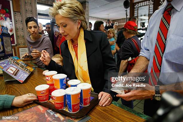 Democratic presidential hopeful U.S. Senator Hillary Clinton looks at the Blizzards she ordered for herself and staff at a Dairy Queen May 4, 2008 in...
