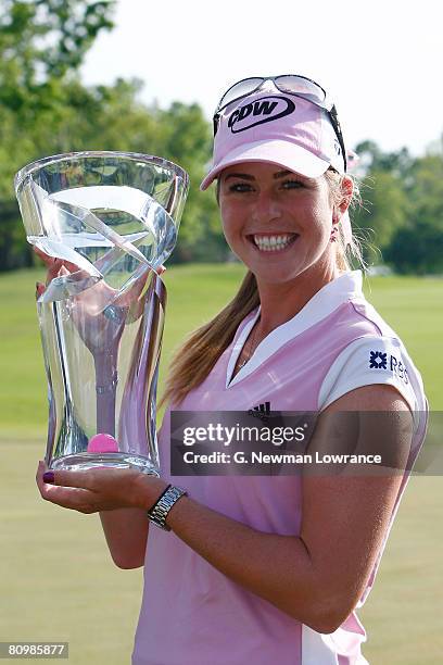 Paula Creamer holds the trophy after defeating Juli Inkster in a playoff of the SemGroup Championship presented by John Q. Hammons on May 4, 2008 at...