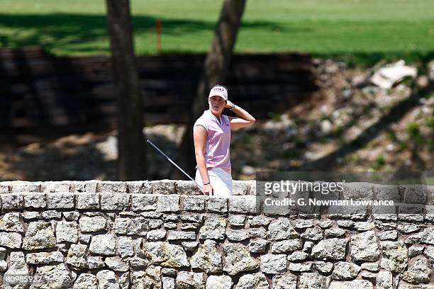 Paula Creamer walks across a bridge to the green on the 3rd hole during the final round of the SemGroup Championship presented by John Q. Hammons on...
