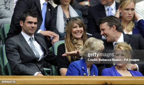 England cricketer James Anderson with his wife Daniella and Graeme Swann in the Royal Box on Centre Court during day two of the 2011 Wimbledon...