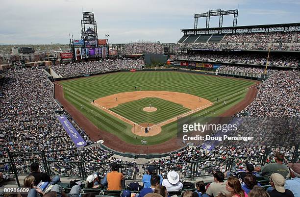 Fans take in the fair weather and the game between the Colorado Rockies and the Los Angeles Dodgers at Coors Field on May 4, 2008 in Denver,...