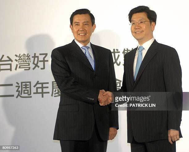 Taiwan's President-elect Ma Ying-jeou shakes hands with Lee Kai-fu, vice president of Google Inc. And president of Greater China at Google's...