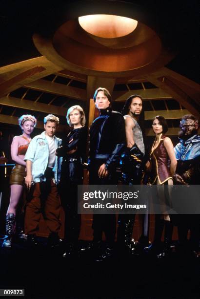 Cast members, from left to right, Laura Bertram, as Trance Gemini; Gordon Michael Woolvett, as Harper; Lisa Ryder, as Beka Valentine; Kevin Sorbo, as...