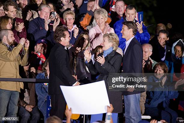 Singer John Mellencamp welcomes Democratic presidential hopeful New York Senator Hillary Rodham Clinton,and Indiana Governor Evan Bayh to the stage...