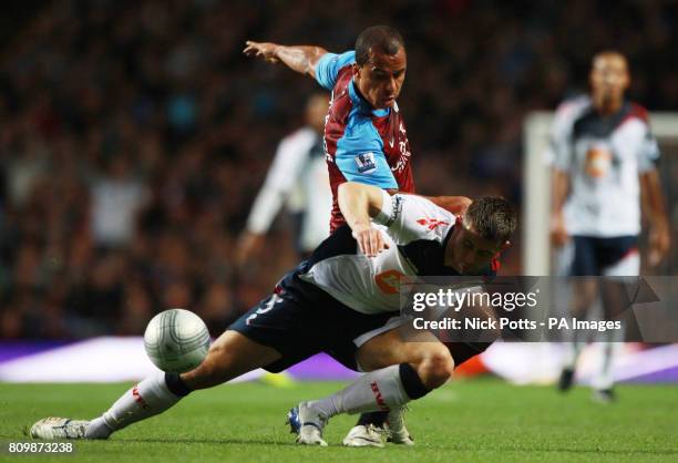 Aston Villa's Gabby Agbonlahor tussles for the ball with Bolton Wanderers defender Gary Cahill during the Carling Cup, Third Round match at the Villa...