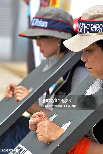 Protesters, including workers from Chinese retailer E-Land Fashion China, the Hong Kong Confederation of Trade Unions and other labour organisations...