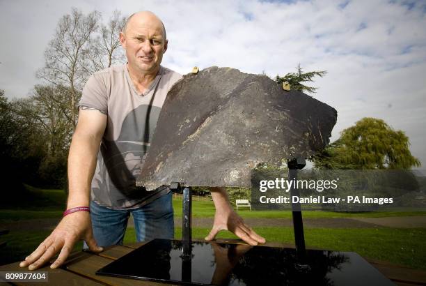 Nigel 'Spud' Ely founder of Trebletap War Relic Art, and former 22nd Special Air Service soldier, with the left buttock of the Saddam Hussein statue,...