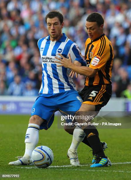 Brighton's Ashley Barnes takes on Hull City James Chester during the nPower Championship at the AMEX Stadium, Brighton.