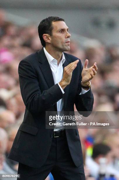 Brighton manager Gus Poyet gestures to his players during the nPower Championship at the AMEX Stadium, Brighton.