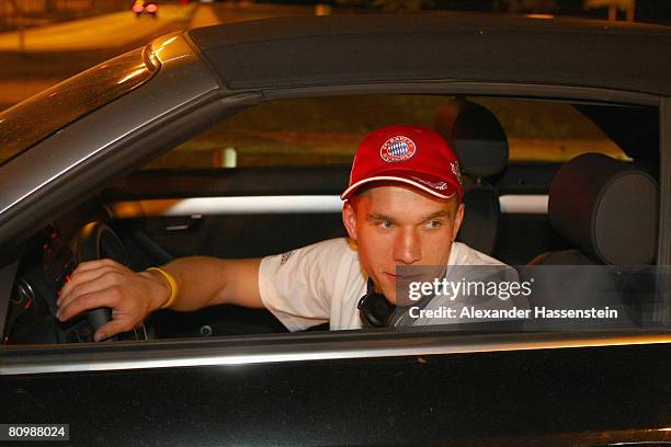 Lukas Podolski of Bayern Munich leaves the parking lot with his car after arriving with his team at the Munich airport on May 4, 2008 in Munich,...