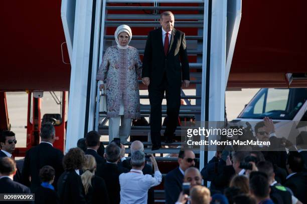 Turkish President Recep Tayyip Erdogan and his wife Emine arrive at Hamburg Airport for the Hamburg G20 economic summit on July 6, 2017 in Hamburg,...