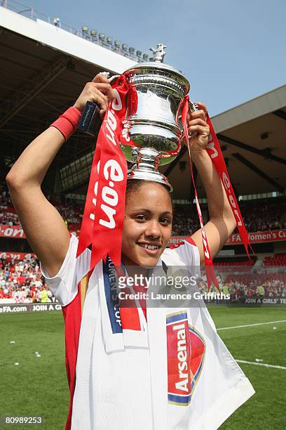 Alex Scott of Arsenal celebres with the trophy after victory in the The FA Womens Cup Sponsored by E.ON match between Arsenal and Leeds United at the...