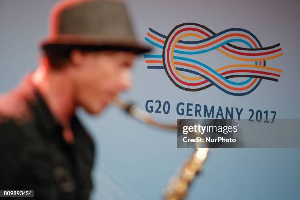 Musician is seen playing the saxophone at a welcome meeting for the press at the Hamburger Messe where the following two days the 2017 G20 meeting...