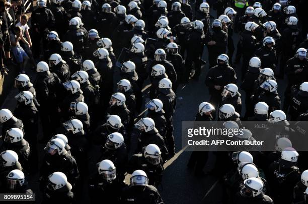 Riot police block the "Welcome to Hell" rally against the G20 summit in Hamburg, northern Germany on July 6, 2017. Leaders of the world's top...