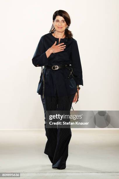 Designer Dorothee Schumacher acknowledges the applause of the audience after her show during the Mercedes-Benz Fashion Week Berlin Spring/Summer 2018...