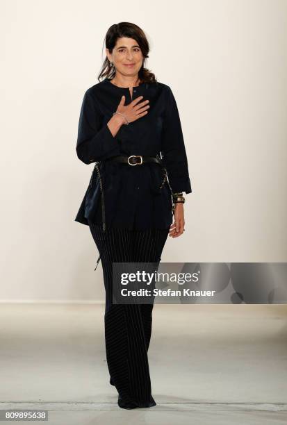 Designer Dorothee Schumacher acknowledges the applause of the audience after her show during the Mercedes-Benz Fashion Week Berlin Spring/Summer 2018...