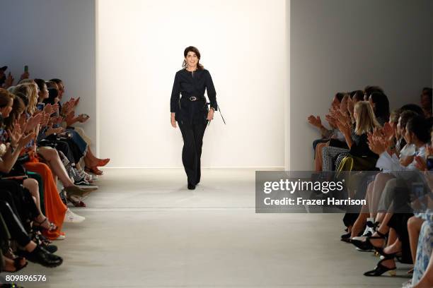 Designer Dorothee Schumacher acknowledges the applause of the audience after her show during the Mercedes-Benz Fashion Week Berlin Spring/Summer 2018...