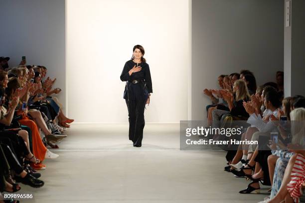 Designer Dorothee Schumacher acknowledges the applause of the audience after her show during the Mercedes-Benz Fashion Week Berlin Spring/Summer 2018...
