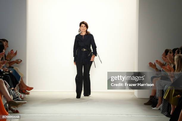 Designer Dorothee Schumacher acknowledges the applause of the audience after her show during the Mercedes-Benz Fashion Week Berlin Spring/Summer 2018...