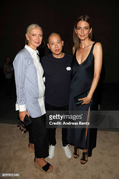 Christiane Arp, Jason Wu and Eva Padberg pose after the Hugo Boss presentation during 'Der Berliner Mode Salon' Spring/Summer 2018 at St. Agnes...