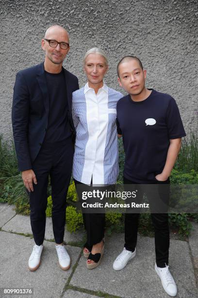 Ingo Wilts, Christiane Arp and Jason Wu arrive to the Hugo Boss presentation during 'Der Berliner Mode Salon' Spring/Summer 2018 at St. Agnes Church...