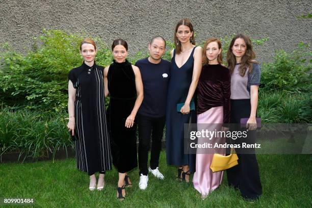 Katharina Schuettler, Hannah Herzsprung, Jason Wu, Eva Padberg, Katharina Schuettler and Alice Dwyer pose at the Hugo Boss presentation during 'Der...