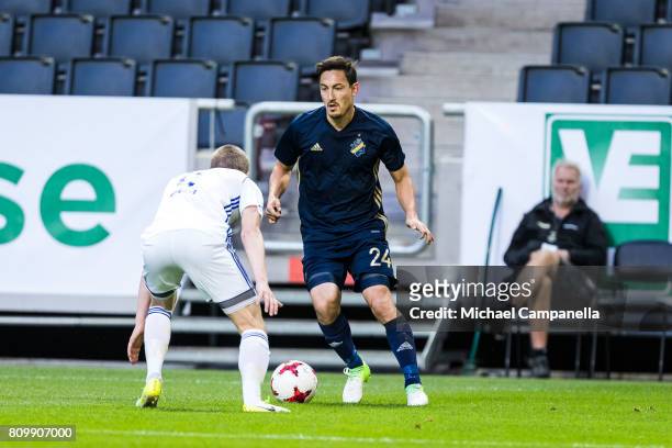 Stefan Ishizaki of AIK in a duel with Joannes Bjartalio of KI Klaksvik during a UEFA Europe League qualification match at Friends arena on July 6,...