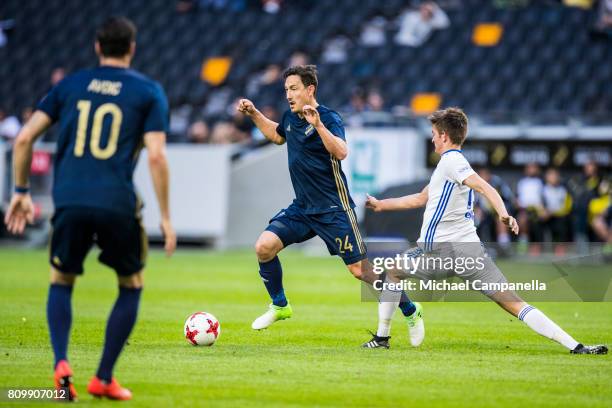 Stefan Ishizaki of AIK in a duel with Jakup Andreasen of KI Klaksvik during a UEFA Europe League qualification match at Friends arena on July 6, 2017...