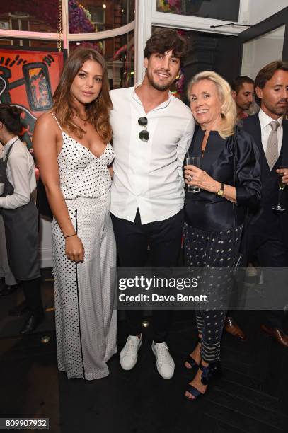 Chloe Lewis, Danny Flasher and Danielle Nicholls attend a private view of 'One Love', the first UK solo exhibition from LA artist Danny Minnick at...