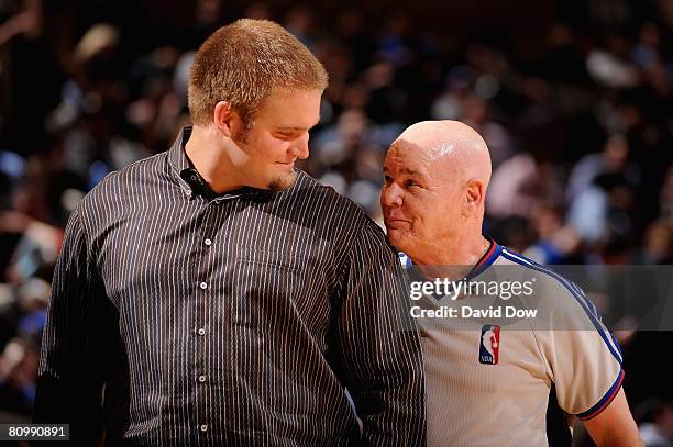 Adam Koets of the New York Giants chats with referee Joey Crawford during a break in the game between the Indiana Pacers and New York Knicks on...