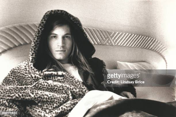 Evan Dando of the Lemonheads relaxes in cheetah faux fur hooded robe during photo session at the Hollywood Roosevelt Hotel on December 8, 1992 in Los...
