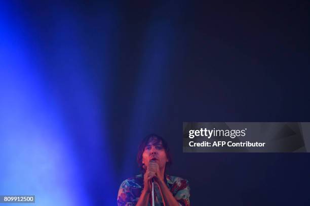 Lead singer of French band Phoenix, Thomas Mars performs during the 11th Alive Festival in Oeiras, near Lisbon on July 6, 2017. / AFP PHOTO /...