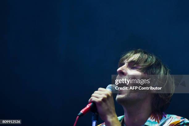 Lead singer of French band Phoenix, Thomas Mars performs during the 11th Alive Festival in Oeiras, near Lisbon on July 6, 2017. / AFP PHOTO /...