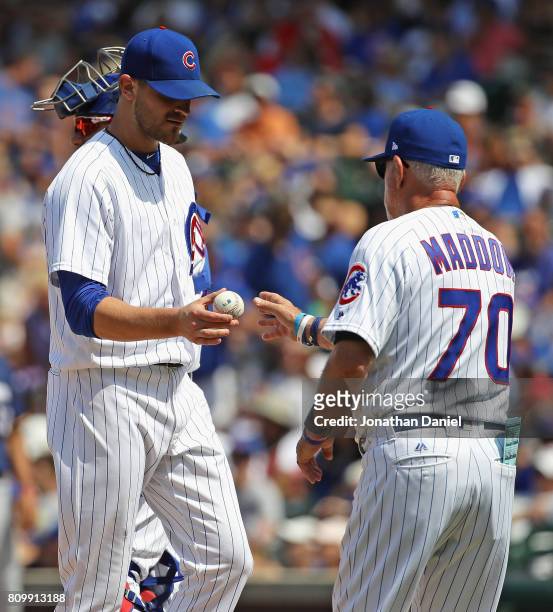 Justin Grimm of the Chicago Cubs is taken out of the game against the Milwaukee Brewers in the 5th inning by manager Joe Maddon at Wrigley Field on...