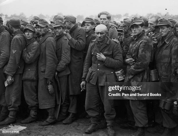 German Prisoners of War Queueing For Food and Water.