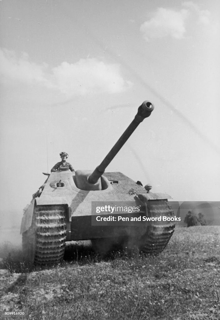 A German Soldier Riding in a Tank