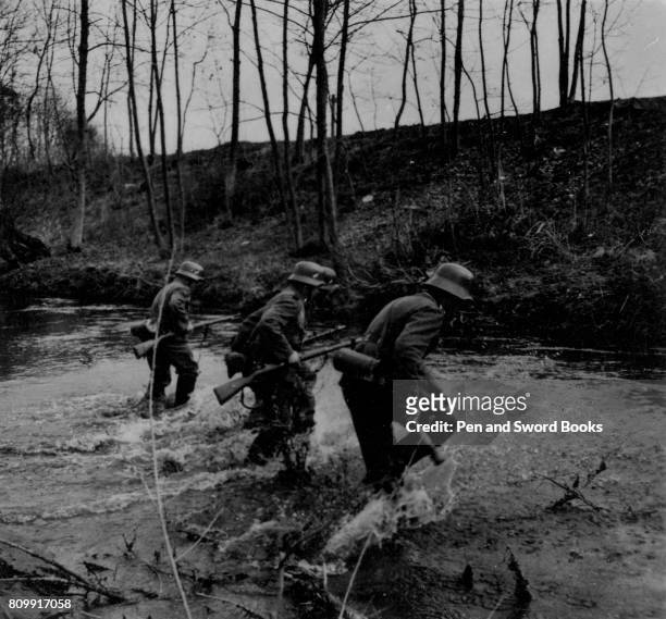 German Soldiers Charging Across a River.