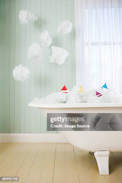 boats on waves in a bath - boat in bath tub stock pictures, royalty-free photos & images