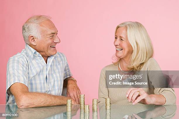 couple with coins - old money stock-fotos und bilder