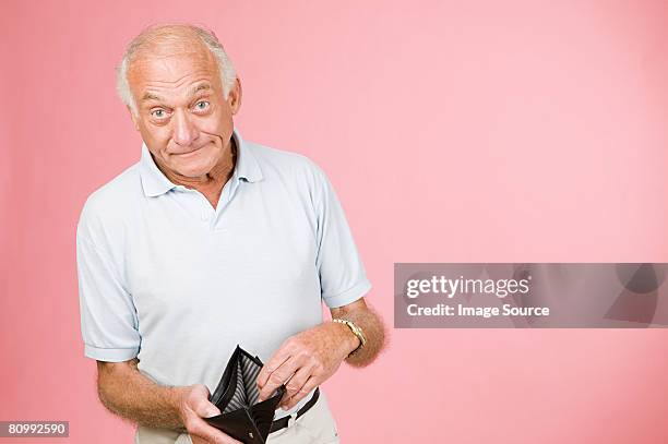 man with empty wallet - empty wallet stock pictures, royalty-free photos & images