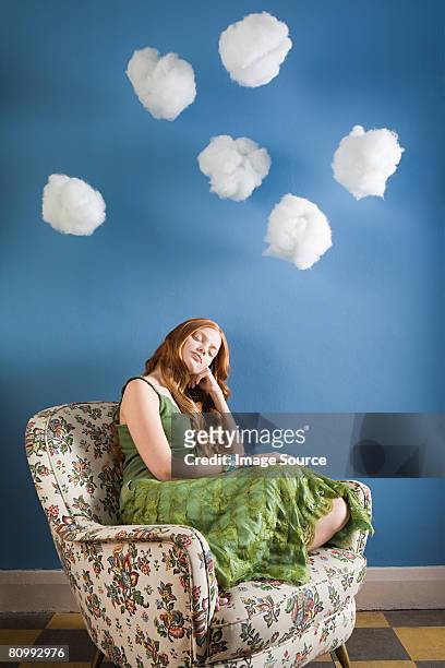 a young woman sleeping - sitting on a cloud stock pictures, royalty-free photos & images