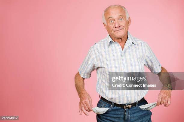 man with empty pockets - hosentasche stock-fotos und bilder