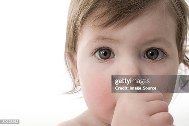 baby girl sucking her thumb - thumb sucking stock pictures, royalty-free photos & images