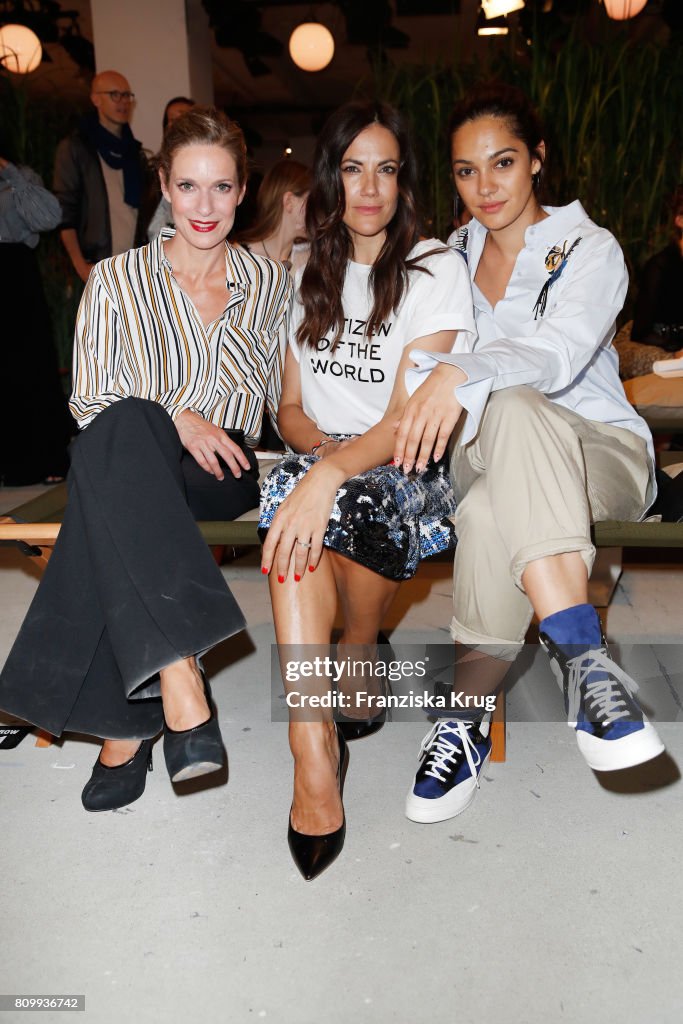 Lisa Martinek, Bettina Zimmermann and a fashion show guest attend the