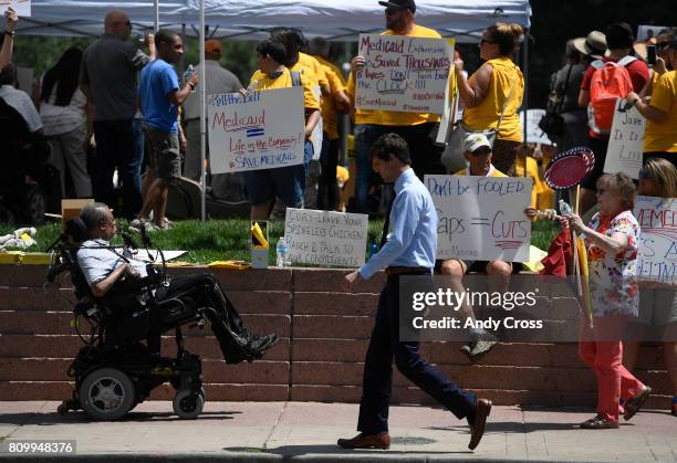 Save Medicaid Rally at Skyline Park near U.S. Sen. Cory Gardner's Denver office July 06, 2017 in Denver. Several hundred protesters gathered to keep...