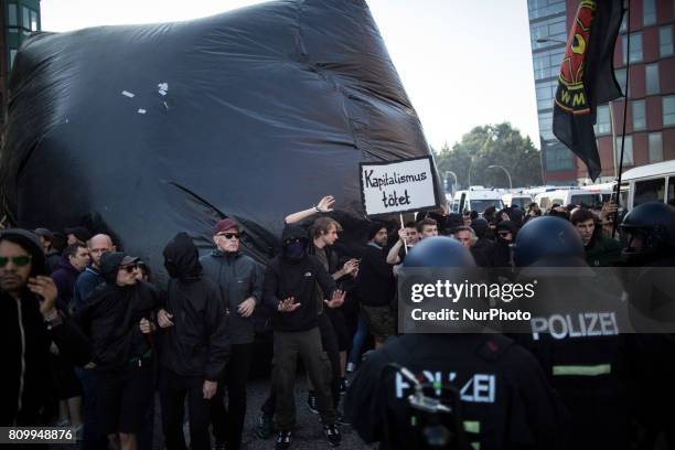 Police Forces clash with protesters during a march on July 7, 2017 in Hamburg, Germany. Leaders of the G20 group of nations are arriving in Hamburg...